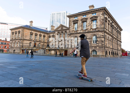 Skateboarder in front of Custom House, Belfast. Custom House is in the background. Slight motion blur Stock Photo