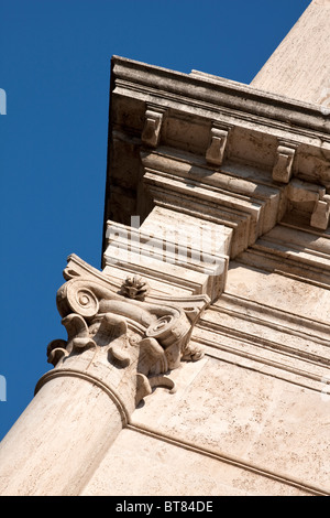 Particular, close up of a column with a Ionic capital Temple in Rome, Italy Stock Photo