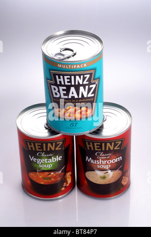 Cans of Heinz Baked Beans in Tomato sauce, Heinz Classic Vegetable Soup and Heinz Classic Cream of Mushroom Soup from UK. Stock Photo