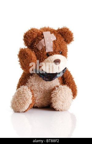 Teddy bear with a band aid on his head Stock Photo