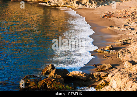 Evening light on surf at Headland Cove, Point Lobos State Reserve, Carmel, California Stock Photo
