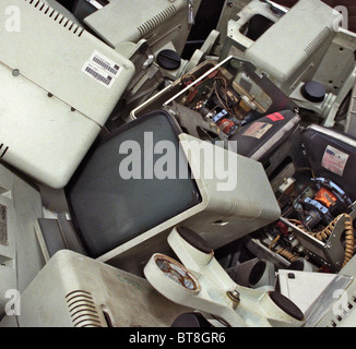 Redundant computer equipment in a dump skip Stock Photo