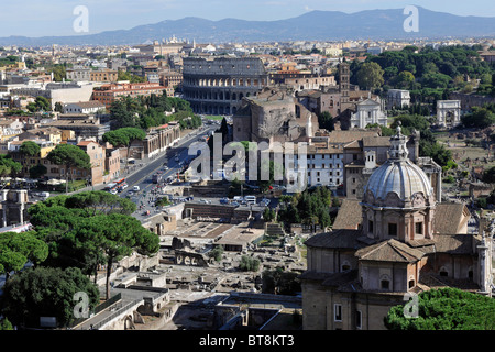 View from Complesso del Vittoriano (Victor Emmanuel Monument) looking towards the Colosseum with the Forum on the right, Rome, Stock Photo