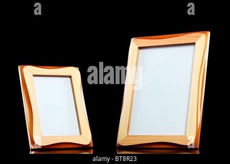 two wooden picture frames against black background Stock Photo