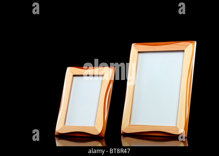 two wooden picture frames against black background Stock Photo