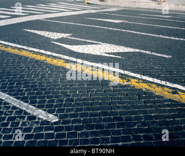 Road marking painted onto the cobblestones of the Via della Conciliazione leading to St. Peter's Basilica in Rome Stock Photo