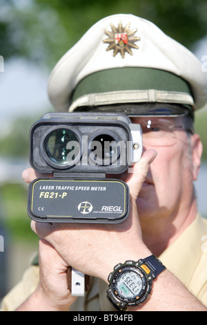 Police Officer Checking Speed With Radar Gun Stock Photo - Alamy