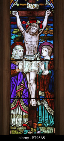 A Stained glass window depicting The Crucifixion, Parish Church of St Thomas, Kentisbury, Devon Stock Photo