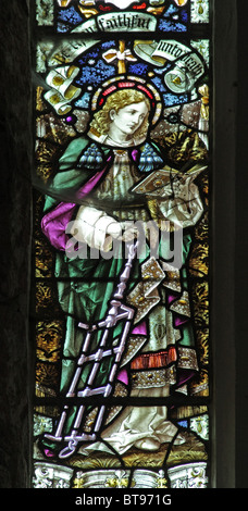 A stained glass window depicting Saint Lawrence with the grid iron on which he was martyred, Marwood, Devon Stock Photo