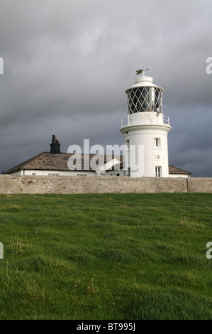 Dramatic stormy sky over St Bees  Head Lighthouse Fleswick Bay Cumbria England UK GB Stock Photo