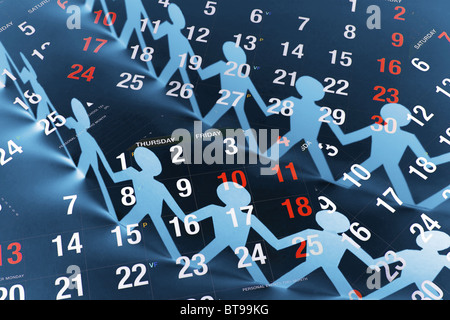 Paper Chain Dolls and Calendar Stock Photo