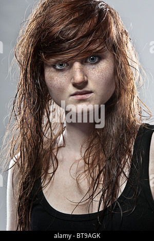 Shot of a Young Teenage Girl with Red Hair and Freckles Stock Photo