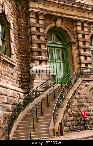 Detail of stone window and staircase on a building in Montreal, Canada Stock Photo