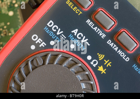 Electronic symbols on an electronic measuring multimeter device Stock Photo