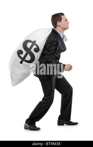 Full length portrait of a businessman carrying a money bag with US dollar sign Stock Photo