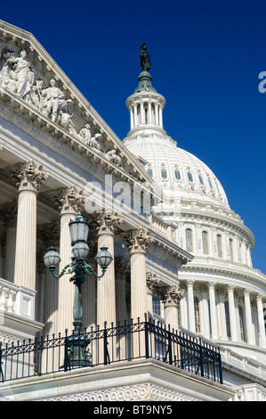 WASHINGTON, DC, United States — The United States Capitol Building stands majestically on Capitol Hill, its iconic dome rising above the east and west wings that house the Senate and House of Representatives. This neoclassical masterpiece, home to the U.S. Congress, serves as the seat of the legislative branch of the federal government. Its striking white exterior and grand architecture make it one of the most recognizable symbols of American democracy and governance. Stock Photo