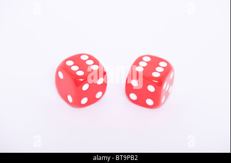 A pair of red dice both showing a six on a white background Stock Photo