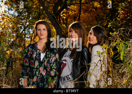 Three teenage girls student friends after school in a forest with Fall colors Toronto Stock Photo