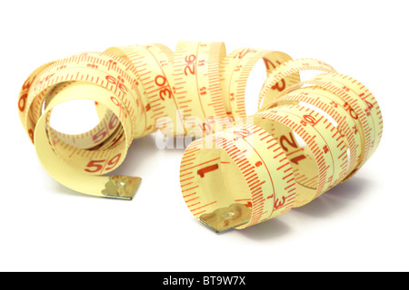 Coil of measuring tape on white background Stock Photo