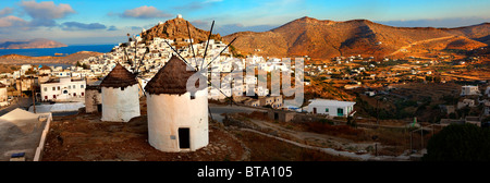 The Windmills overlooking Chora town. Ios Cylcades Islands, Greece. Stock Photo