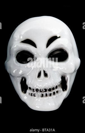 plastic human skul in closeupl isolated on black background Stock Photo