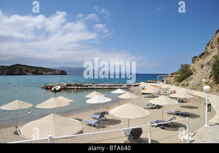 The small harbour and sandy beach at Istria Bay, northern Crete, Greece Stock Photo