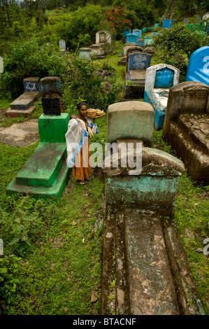 a woman with child in the jewish cemetery in wolleka, ethiopia Stock Photo