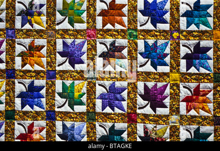 Close up colorful handmade duvet quilt pattern with fall colour maple autumn leaves in Lancaster County, Pennsylvania, USA, US, America, bed comforter Stock Photo