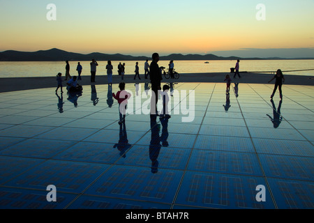 Croatia, Zadar, sunset, people, Greeting to the Sun monument, Stock Photo