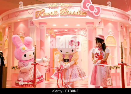 TOKYO, Japan - Hello Kitty dressed in a pink tartan outfit poses beside a  series of tartan-themed goods at the British Embassy in Tokyo on June 10.  (Kyodo Stock Photo - Alamy