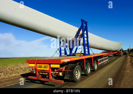 Giant blades for a wind turbine being transported by road in South Lanarkshire, Scotland Stock Photo