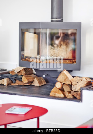Wood burning stove in an architect-designed home Stock Photo