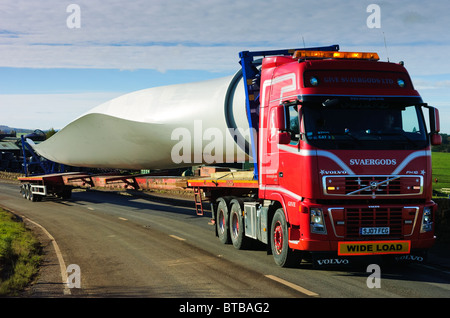 Giant blades for a wind turbine being transported by road in South Lanarkshire, Scotland Stock Photo