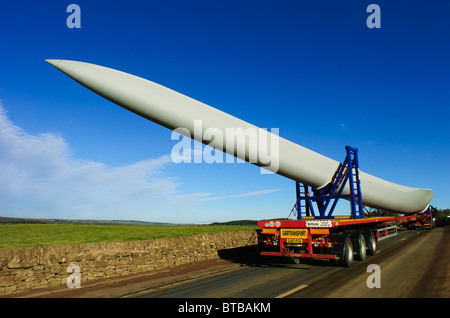 Giant blades for a wind turbine being transported by road in South Lanarkshire, Scotland Stock Photo