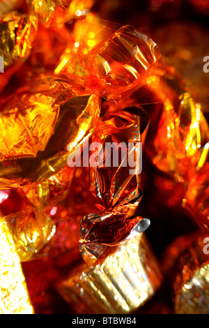 chocolate and toffee sweets in colorful wrappers Stock Photo