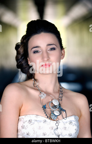 Gorgeous Woman in wedding dress inside tunnel Stock Photo