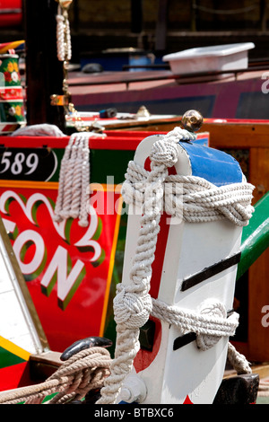 White plaited ropes and turks heads on a rudder of a historic narrow boat moored at the Rickmansworth Festival. DAVID MANSELL Stock Photo