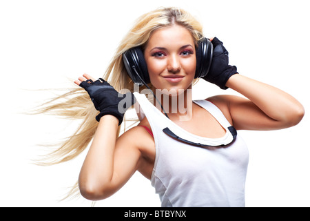 Young woman with big headphones. Isolated on white. Stock Photo