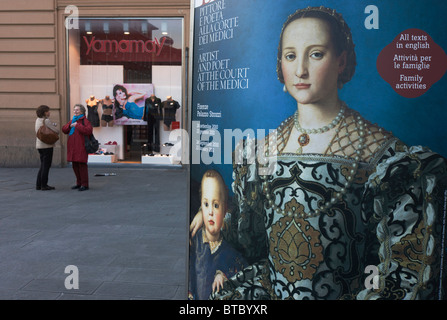 Modern Italian women shoppers and Agnolo de Cosimo Bronzino's painting of the Medici Eleanora of Toledo and son Giovanni C1545. Stock Photo