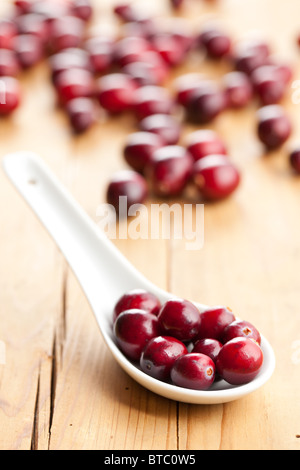 the fresh cranberries on kitchen table Stock Photo