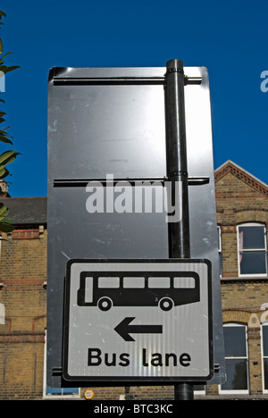 british traffic sign on the approach to a junction indicating a bus lane to the left, in ealing, west london, england Stock Photo