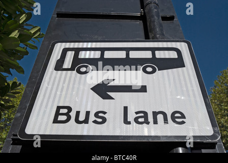 british traffic sign on the approach to a junction indicating a bus lane to the left, in ealing, west london, england Stock Photo