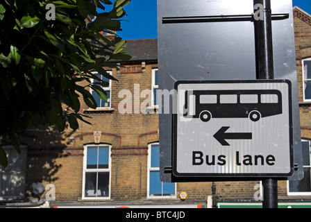 british traffic sign on the approach to a junction indicating a bus lane to the left, in ealing, west london, england Stock Photo