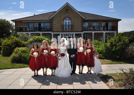 wedding group shot bridesmaids with bride and groom Stock Photo