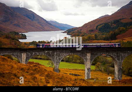 First Scotrail Diesel Train crossing the Glenfinnan Viaduct in Autumn, West Highland Line, Loch Shiel, Lochaber, Scotland UK Stock Photo