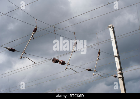 Electrified overhead lines over railway track on the midland main line, England. Stock Photo