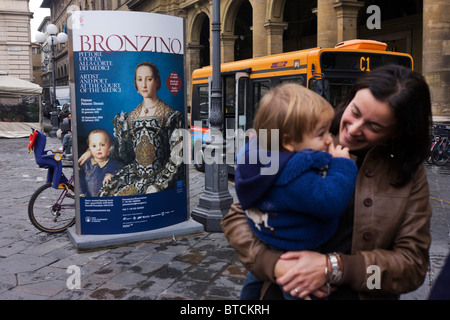 Modern Italian mother and child and Agnolo de Cosimo Bronzino's painting of the Medici Eleanora of Toledo and son Giovanni c1545 Stock Photo