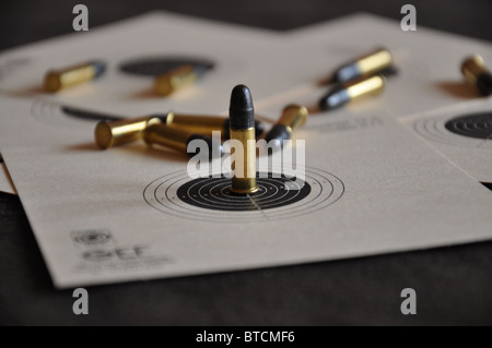 22 long rifle bullets on targets Stock Photo
