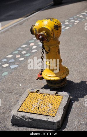 Yellow fire hydrant in Kuala Lumpur Stock Photo