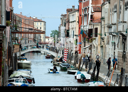 Parked Boats on Canal in Venice Italy Stock Photo
